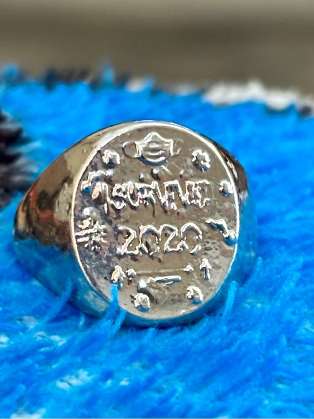 Silver- perhaps or plated 
 FOREVER 2020 Engraved Signet Ring size 6
